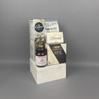 A gift hamper set in a white textured wooden crate, featuring a box of Carr's crackers, Provisions Red Pepper jelly, Cantucci almond biscotti, Milk Chocolate Almonds, Castello Brie cheese.